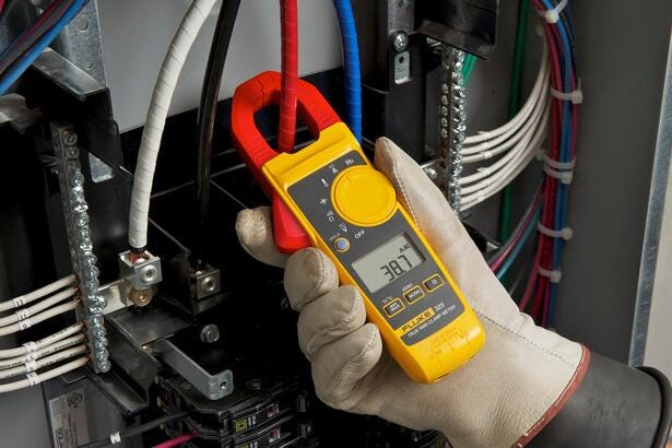Vue détaillée de la pince multimètre Fluke 325 avec sélecteur de fonctions