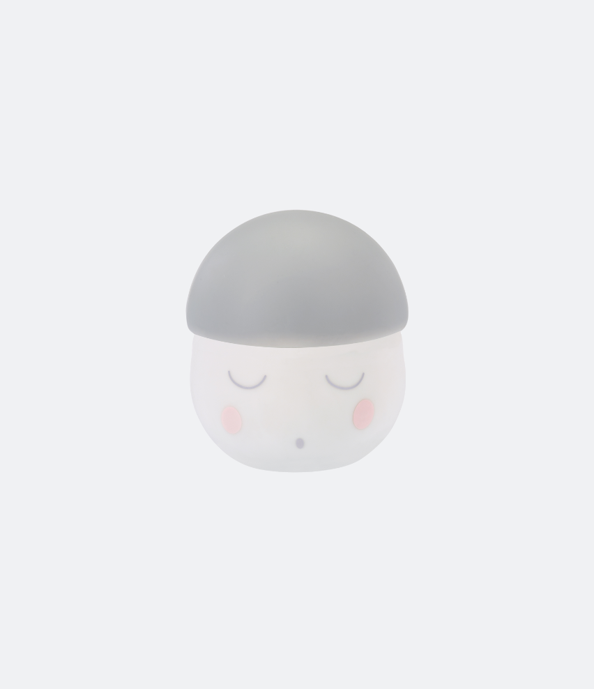 Veilleuse rechargeable Babymoov Squeezy grise sur fond blanc, dôme gris mat surmontant une base blanche translucide avec un visage endormi