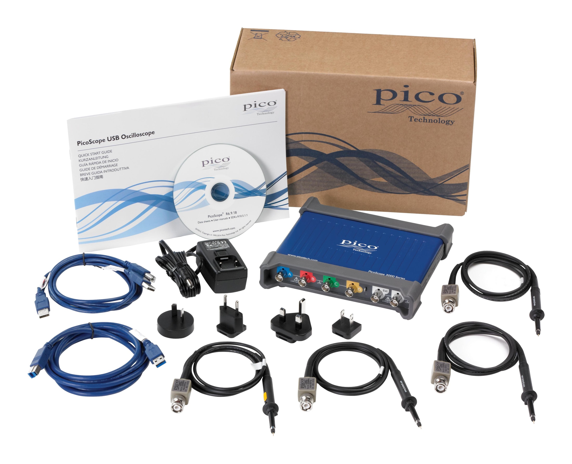 Le contenu complet d’un coffret PicoScope USB Oscilloscope de la marque Pico Technology, incluant l’appareil bleu, des câbles USB, des sondes, un adaptateur secteur, un CD et la documentation.