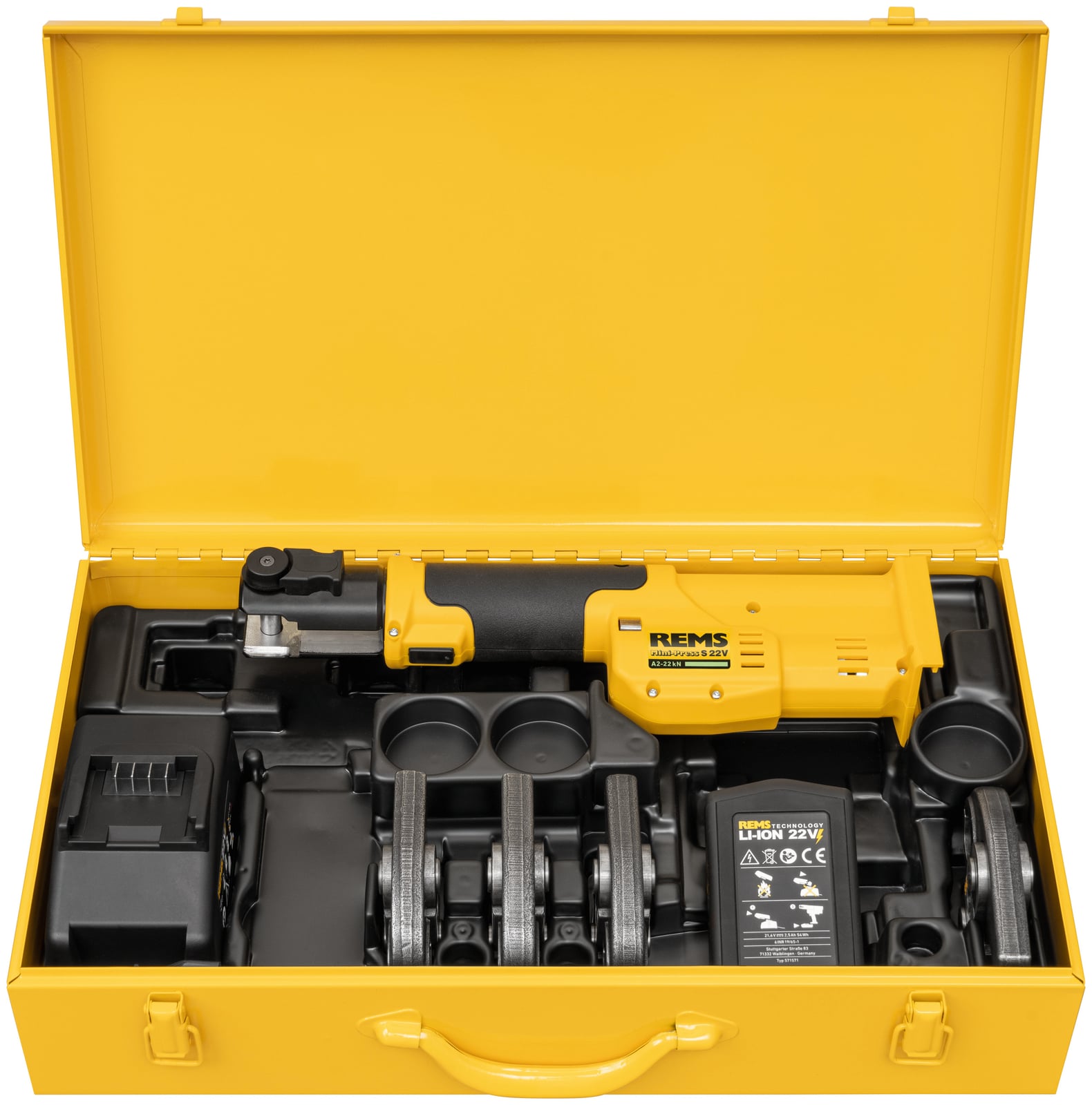 Coffret acier jaune REMS ouvert avec la Mini-Press, ses batteries, son chargeur et ses mâchoires